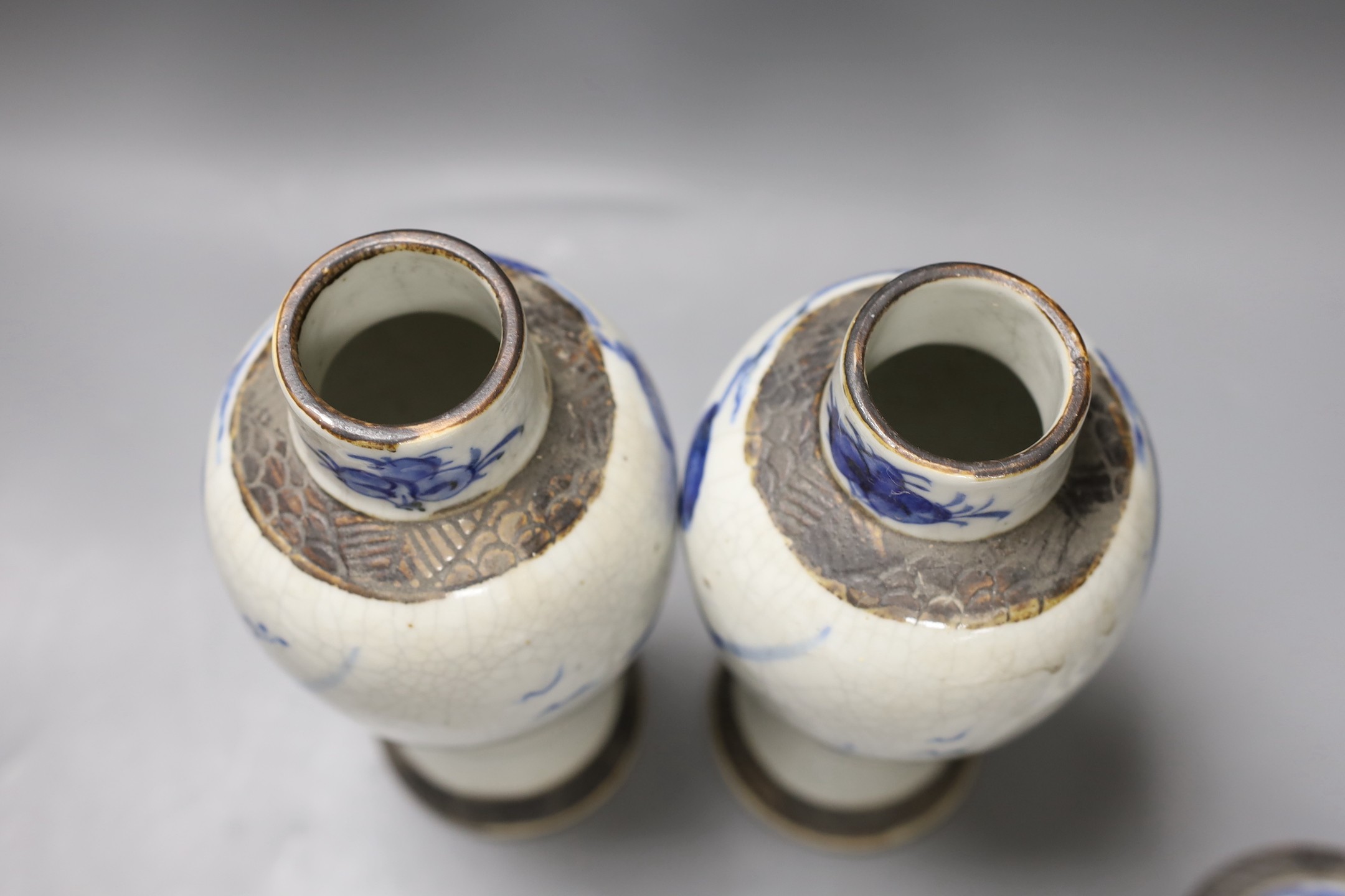 A pair of early 20th century Chinese blue and white crackle glaze vases and covers, 30cm